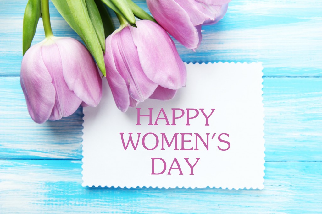 Beautiful bouquet of purple tulips and blank card