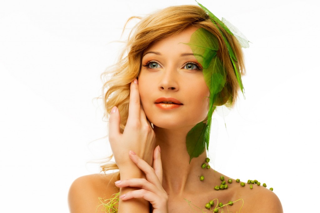 Beautiful young woman in conceptual spring costume