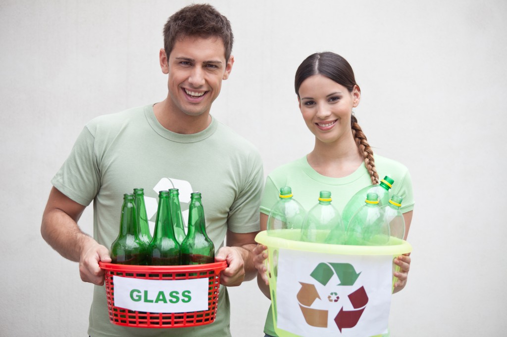 Couple holding containers with bottles